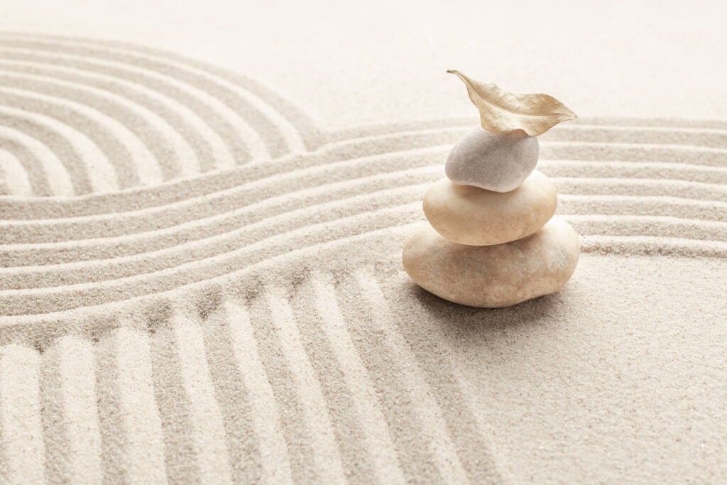 stacked-zen-marble-stones-sand-background-in-mindf-CXHBWQR.jpg